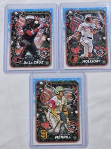 lot 80 image: Lot of 3 Baseball Cards Featuring Elly De La Cruz, Jackson Holliday, and Jackson Merrill Rookie Cards.