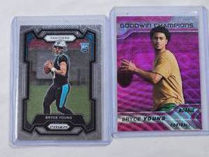 lot 126 image: Lot of 2 Bryce Young Football Rookie Cards featuring Panini Prizm and Goodwin Champions Pink Wave