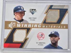 lot 183 image: Jake Peavy, CC Sabathia 2009 Upper Deck SPx Winning Materials Dual Relic #WM2-PS - San Diego Padres, New York Yankees Baseball Card