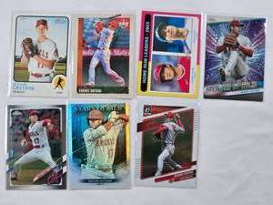 lot 209 image: Lot of 7 Shohei Ohtani Baseball Cards Including Topps Heritage, Topps Chrome, Panini Diamond Kings, and Stars of MLB Holo Cards