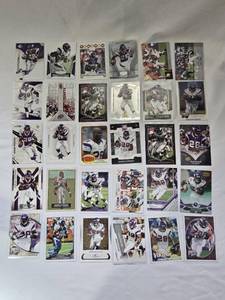 lot 289 image: Lot of 30 Adrian Peterson Football Cards featuring various brands and designs including SP Authentic, Topps, and Donruss