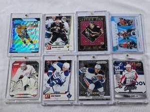 lot 380 image: Lot of 8 Hockey Cards Most in Magnetic One Touch Cases Featuring Players Including Brenden Morrow, Dion Phaneuf, and Jaromir Jagr with Special Features Like Rookies and Limited Editions.