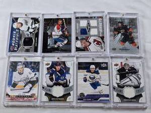 lot 383 image: Lot of 8 Hockey Cards in Magnetic One Touch Cases Featuring Gabe Vilardi, Samuel Fagemo, Isak Rosen, Jonathan Quick, Jaden Schwartz, Jacob Perreault, Peter Stastny, and Guy Lafleur. Includes Rookie Cards, Patches, and Special Edition Cards.