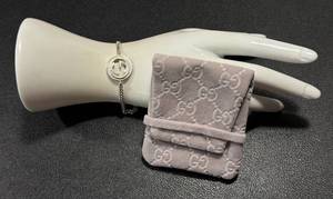 lot 9AC image: Gucci Sterling Silver GG Logo Chain Bracelet with Pouch