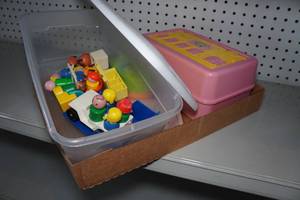 lot 117 image: Cabbage Patch Doll and Little People Wood Toys