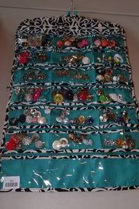 lot 167 image: Hanging Jewelry Organizer with Earrings and Brooches