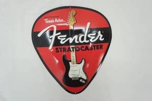 lot 49 image: Fender Stratocaster Metal Guitar Pick Shaped Sign