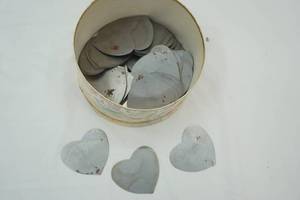 lot 111 image: hat box full of metal hearts