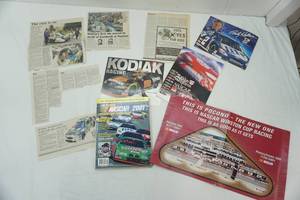 lot 166 image: NASCAR 2001 Official Statistics and Schedules Pocono 500 Poster Rusty Wallace Signed Poster, Newspaper Clippings