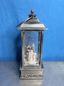 lot 37 image: Snow Globe Lantern with a Snowman Scene Inside.
