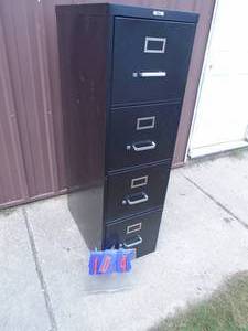 4 drawer filing cabinet. With hanging files. Used condition. As shown.