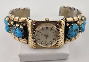 lot 43 image: Navajo Silver With Gold Overlay & Turquoise Cuff Band With Longines Watch