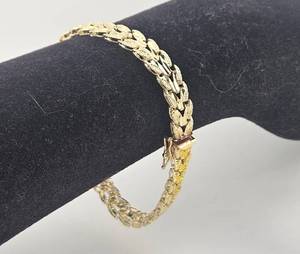 lot 14 image: Fancy Diamond Cut 14kt Yellow Gold Bracelet