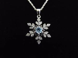 lot 9 image: .925 Sterling Silver Topaz Snowflake Pendant Necklace