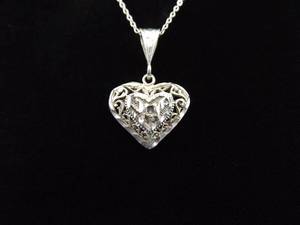 lot 43 image: .925 Sterling Silver Carved Heart Pendant Necklace