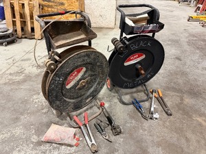 lot 200 image: (2) Black Uline Strapping Carts, strapping tools, safety glasses and seals for strapping