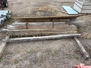 lot 216 image: Posts, possibly treated, approx quality of 17 and varying lengths, 1 large flat sheet of plywood