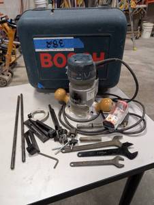 lot 382 image: Bosch 1617 corded fixed-base router. 14 straight bit, other bits, guides, guide rods, knobs