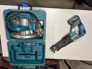 lot 485 image: Makita Cordless Reciprocating Saw XRJ05 w 5.0 battery Makita 5007F corded 7 14 circular saw, case.