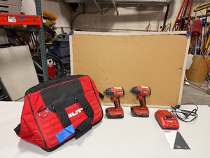 lot 526 image: (2) Hilti SID 4-A22 Impact drivers with batteries and a charger in Hilti bag.