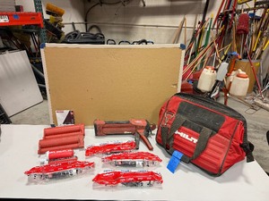 lot 585 image: Hilti HDM500 manual epoxy dispenser gun (2) Powder cartridge Holders (5) Adhesive anchors-new, Hilti bag
