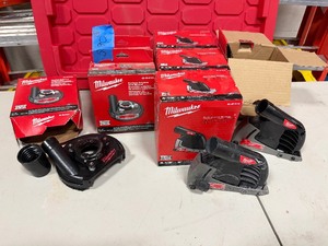 lot 590 image: (3) Milwaukee Surface Grinding Dust Shroud (new in box), (5) Milwaukee Cutting Dust Shroud, Most New
