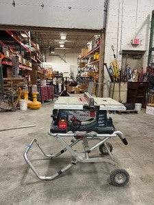 lot 615 image: Bosch 4100 10 table saw with TS3000 portable folding table