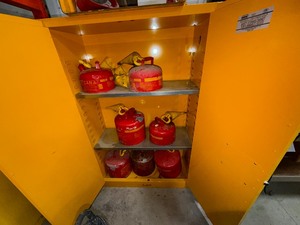 lot 602 image: Edsal Flammable Liquid Storage Cabinets, Eagle steel safety cans all cans are empty, Yellow funnels.