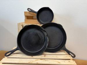 lot 4 image: 3 Cast Iron Skillets - (1) 10 12 inch, (1) number 7 and (1) number 3 which is 6 58 inch