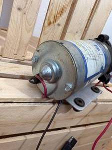 lot 9 image: Sure-flo pump 60 psi 20 V SPM is 5.3, open flow is 1.4 GPMs, amps 7