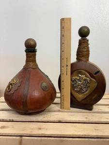 lot 10 image: Two vintage Italian leather wrapped decanter bottles made in Italy