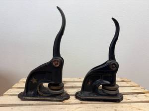 lot 11 image: Two Antique Cast Iron Seal Presses (1) is a SD Notary and the other is The Plantation Company in Sisseton SD