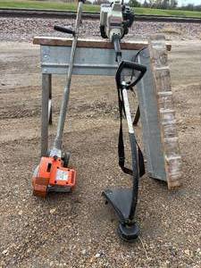 lot 29 image: Multiple piece lot, including electric Black & Decker yard edger very heavy duty craftsman gas, powered Weedwhacker to metal collapsible sawhorses made by EBCO