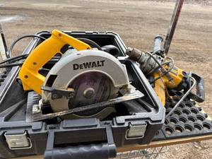 lot 41 image: Electric Dewalt DW359 7 14 inch power saw with case and hammer drill.