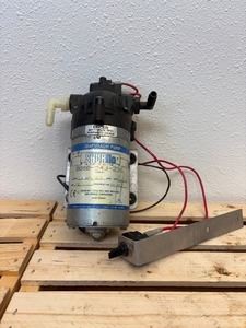 lot 9 image: Sure-flo pump 60 psi 20 V SPM is 5.3, open flow is 1.4 GPMs, amps 7