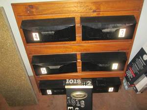 lot 250 image: Metal mail boxes mounted to wood pa...