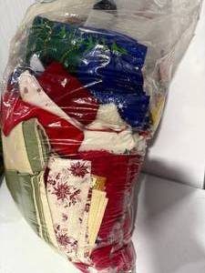 lot 27 image: Bag of Assorted Christmas Linens  Red, Green, and Holiday Prints