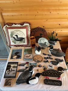 lot 90 image: Loon-Themed Decorative Items and Books