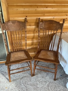 lot 126 image: Wooden Spindle-Back Chairs with Caned Seats and Carved Details