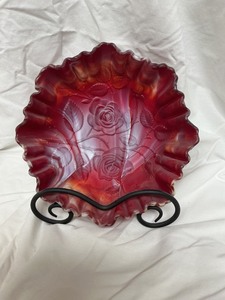 lot 16 image: Red and Yellow and White Slag Glass Bowl with Embossed Roses and Ruffled Edge