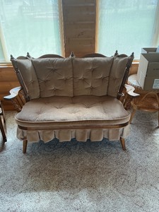 lot 19 image: Wooden Spindle-Back Loveseat with Tufted Upholstery