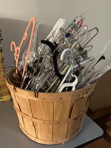 lot 27 image: Large Wooden Basket Filled With Assorted Hangers