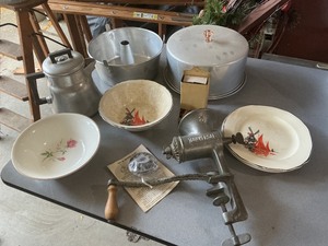 lot 54 image: Vintage Kitchen Items Including Plates, Meat Grinder, and Bakeware