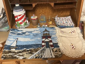 lot 68 image: Lighthouse Lot with Cookie Jar, Candle, Magnets, Placemats, and Pot Holders