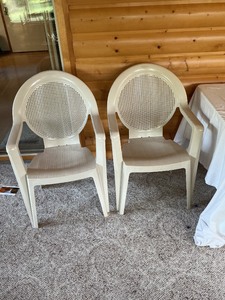 lot 118 image: Two Beige Plastic Patio Chairs with Mesh Backrests
