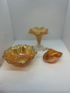 lot 133 image: 3 Amber Carnival Glass Pieces Featuring Bowl, Vase, and Swan