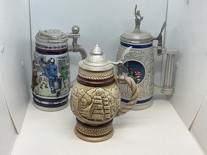 lot 191 image: Three Collectible Avon Beer Steins from 1977, 1984, and 1994