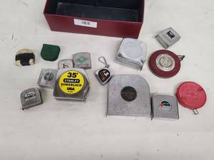 lot 28 image: Collection of Vintage and Modern Tape Measures with Metal Storage Box