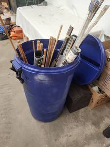 lot 54 image: Large Blue Barrel with Assorted Metal Tubing, Rods, and Screening Material