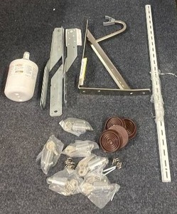 lot 87 image: Assorted Home Hardware Lot with Refrigerator Filter, Brackets, and Shelving Accessories